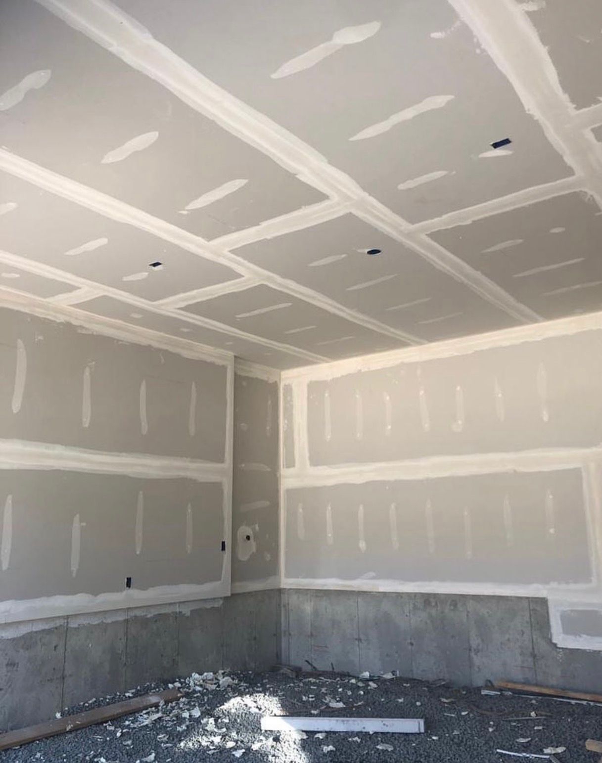 Freshly taped basement drywall ceiling and walls Mississauga