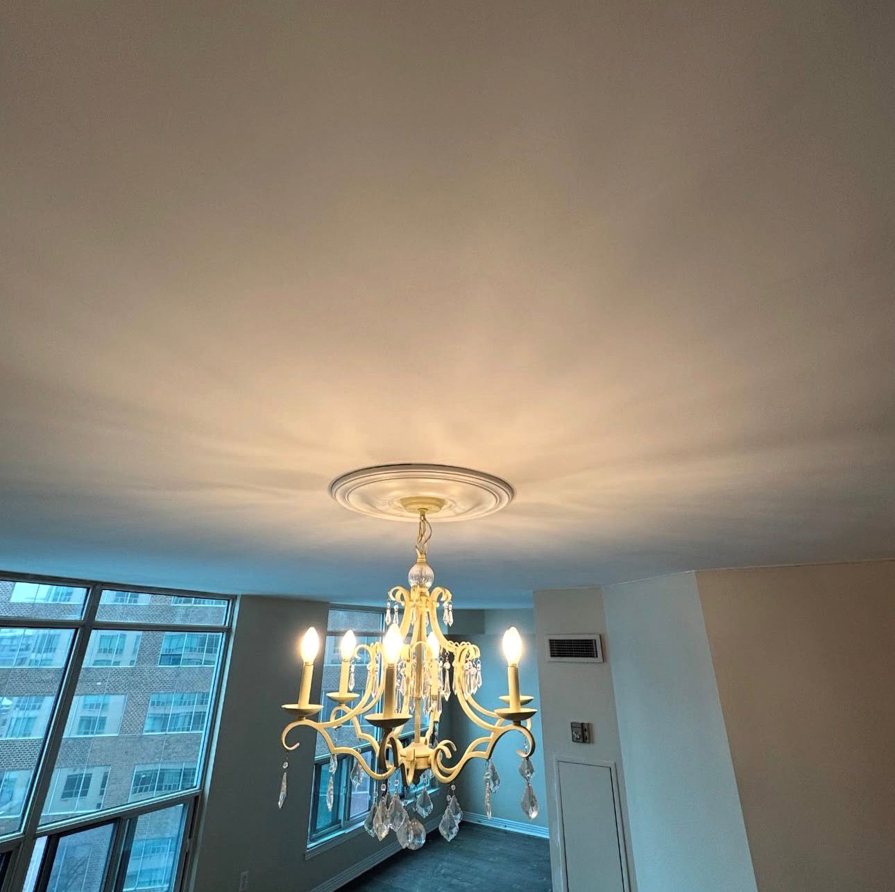 Smooth finished ceiling with chandelier Mississauga condo